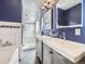 Bathroom with double sinks, subway tile shower, and modern fixtures at 2540 Forest St, Denver, CO 80207