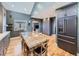 Open-concept dining room features hardwood floors, custom cabinets, and a large window for plenty of natural light at 2540 Forest St, Denver, CO 80207