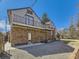 Back of house with second-story deck overlooking the gravel area and backyard at 2540 Forest St, Denver, CO 80207