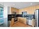 Modern kitchen with stainless steel appliances and dark countertops at 1700 Bassett St # 1105, Denver, CO 80202