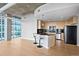 Modern kitchen with breakfast bar and stainless steel appliances at 1700 Bassett St # 1105, Denver, CO 80202