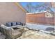 Patio area with modern seating, partially covered by a stucco wall at 1460 S Emerson St, Denver, CO 80210