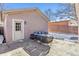 Cozy backyard patio with seating area and attached garage at 1460 S Emerson St, Denver, CO 80210