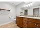 Basement bathroom with double vanity, granite countertops, and tile flooring at 1460 S Emerson St, Denver, CO 80210