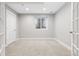 Finished basement bedroom with carpet, large window, and french doors at 1460 S Emerson St, Denver, CO 80210