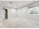 Finished basement bedroom with carpet, large window, and french doors at 1460 S Emerson St, Denver, CO 80210