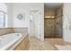 Spa-like bathroom with soaking tub and walk-in shower at 1460 S Emerson St, Denver, CO 80210