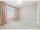 Well-lit bedroom with window and neutral decor at 1460 S Emerson St, Denver, CO 80210