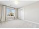 Bright bedroom with window and double doors to closet at 1460 S Emerson St, Denver, CO 80210