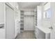 Large walk-in closet with ample shelving and drawers at 1460 S Emerson St, Denver, CO 80210