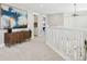 Upstairs hallway with hardwood floors and a modern console at 1460 S Emerson St, Denver, CO 80210