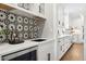 Modern kitchen with white cabinets and quartz countertops at 1460 S Emerson St, Denver, CO 80210