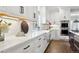 Modern kitchen with white cabinets and a farmhouse sink at 1460 S Emerson St, Denver, CO 80210