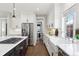 Modern kitchen with stainless steel appliances and an island at 1460 S Emerson St, Denver, CO 80210