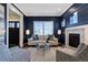 Living room with navy-blue shiplap wall, fireplace and comfortable seating at 1460 S Emerson St, Denver, CO 80210