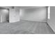 Large bedroom features neutral carpet and light walls at 7977 S Kittredge St, Englewood, CO 80112