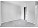 Bright bedroom featuring gray walls, carpet, and closet space at 7977 S Kittredge St, Englewood, CO 80112