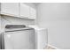 Modern laundry room featuring new washer and dryer units at 7977 S Kittredge St, Englewood, CO 80112