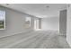 Bright living room featuring large windows with blinds, plush carpeting and neutral paint at 7977 S Kittredge St, Englewood, CO 80112