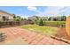 Brick patio in a fenced backyard with green grass at 7977 S Kittredge St, Englewood, CO 80112