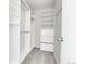 Walk-in closet with custom shelving and built-in storage drawers at 7977 S Kittredge St, Englewood, CO 80112
