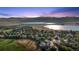 Panoramic aerial view of the community, showcasing nearby lakes and scenic mountain views at 7158 Torrey St, Arvada, CO 80007