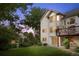 Spacious backyard with deck and view of home's architecture at 7158 Torrey St, Arvada, CO 80007