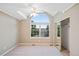 Bedroom with vaulted ceiling, large window, and sliding door closet at 7158 Torrey St, Arvada, CO 80007