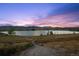 Scenic view of the lake and surrounding landscape, perfect for nature lovers at 7158 Torrey St, Arvada, CO 80007