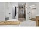 Bright bathroom with a soaking tub, shower, and stylish fixtures at 6424 S Routt St, Littleton, CO 80127