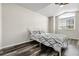 Bright bedroom with a comfortable bed and large window at 6424 S Routt St, Littleton, CO 80127