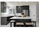 Modern kitchen with stainless steel appliances, sleek countertops, and a large island at 6424 S Routt St, Littleton, CO 80127