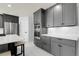 Beautiful kitchen with built-in stainless appliances, sleek cabinetry, and subway tile at 6424 S Routt St, Littleton, CO 80127