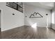 Airy living room featuring a loft space, large windows, and modern mountain art at 6424 S Routt St, Littleton, CO 80127