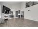Spacious room featuring modern fireplace with a view to the open concept eat-in kitchen at 6424 S Routt St, Littleton, CO 80127