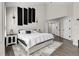 Spacious primary bedroom with modern design elements, including dark accent walls and stylish lighting at 6424 S Routt St, Littleton, CO 80127
