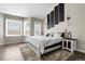 Bright primary bedroom featuring large windows, modern decor, and ample space at 6424 S Routt St, Littleton, CO 80127