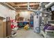 Unfinished basement area containing exposed pipes, hot water heater, and storage space at 4644 W 112Th Ct, Westminster, CO 80031