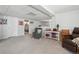 Finished basement area featuring neutral decor and comfortable seating with an open doorway to the bedroom at 4644 W 112Th Ct, Westminster, CO 80031