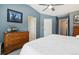 Bedroom with vaulted ceiling, a ceiling fan, and white bedding at 4644 W 112Th Ct, Westminster, CO 80031