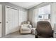 Bedroom or office featuring sliding closet doors, a chair, curtains, and a window at 4644 W 112Th Ct, Westminster, CO 80031