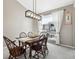 Elegant dining room with modern lighting and a dark wood table that seats six at 4644 W 112Th Ct, Westminster, CO 80031