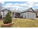 Charming single-story home with manicured front yard and a welcoming covered front porch at 4644 W 112Th Ct, Westminster, CO 80031