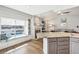 Bright room featuring window seating, a granite island and a cozy fireplace at 4644 W 112Th Ct, Westminster, CO 80031