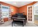 Office with a window, a piano, and view of a second living space at 4644 W 112Th Ct, Westminster, CO 80031