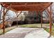 Backyard showcasing a patio with a wooden pergola at 3400 Moore St, Wheat Ridge, CO 80033