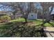 Lush backyard featuring a shed and shade tree, offering ample space for outdoor activities and relaxation at 3400 Moore St, Wheat Ridge, CO 80033