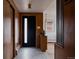 Inviting foyer with modern decor, sleek lighting, and view into a stylish living room at 3400 Moore St, Wheat Ridge, CO 80033