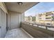 View from the balcony overlooking a nearby community and parking area at 23678 Pondview Pl # D, Golden, CO 80401