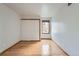 Bright bedroom featuring wood floors and a window view at 23678 Pondview Pl # D, Golden, CO 80401